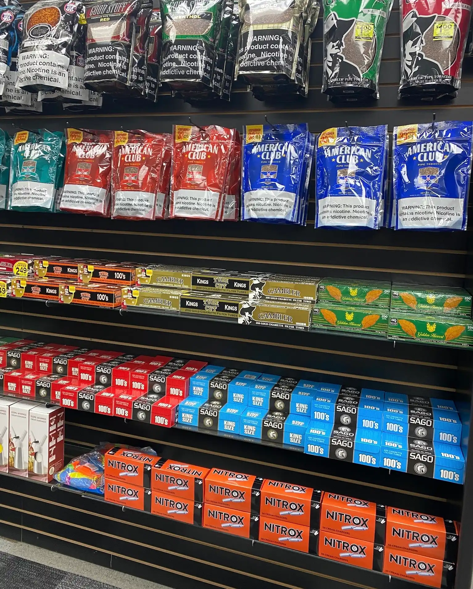 Shelves stocked with smoke shop products at Lux Smoke